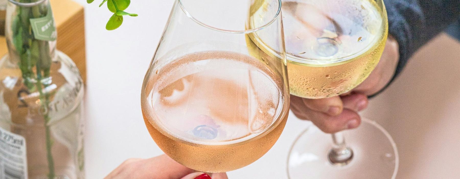 a people holding glasses of wine